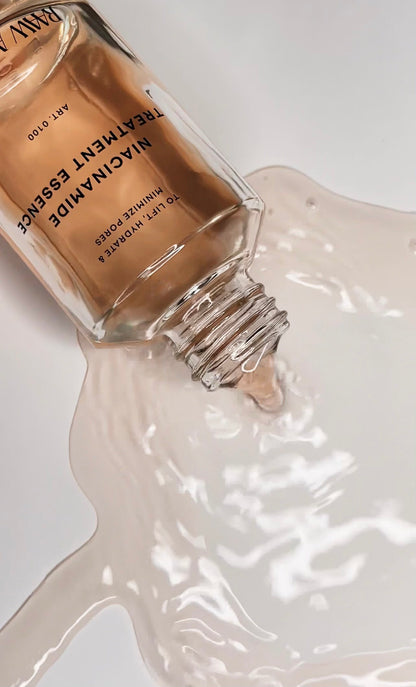 Silky liquid texture of RAAW Alchemy Niacinamide Treatment Essence being poured, showing its fast-absorbing formula.