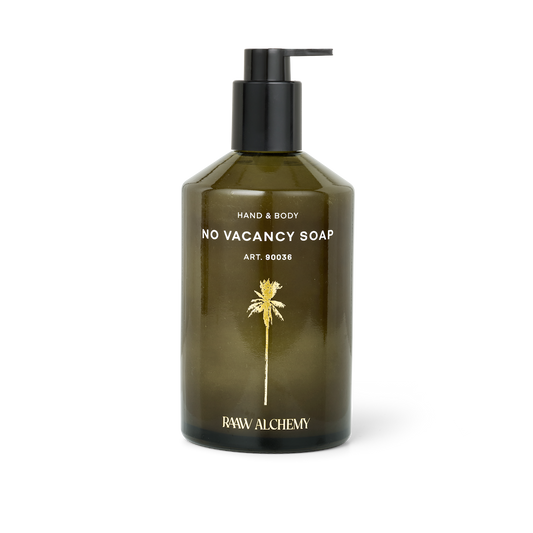 RAAW Alchemy Hand & Body Soap – luxurious organic soap in a signature green glass bottle with pump.
