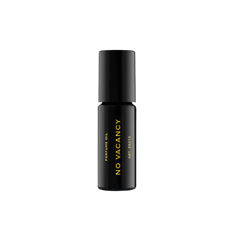 RAAW Alchemy Petit Sauvage perfume oil rollerball in a travel-friendly black glass bottle with gold branding.