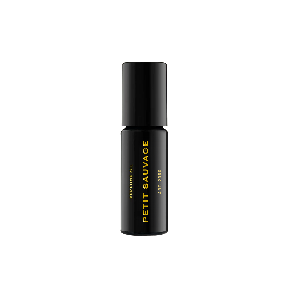 RAAW Alchemy Room 64 perfume oil rollerball, a woody and timeless scent in a compact black glass bottle.