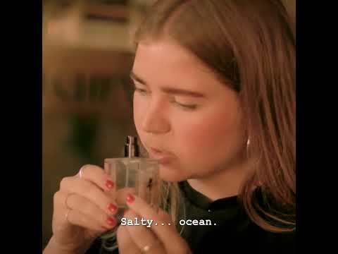 A person experiencing the scent of Hazy Vanille Eau de Parfum, highlighting its salty and oceanic vanilla notes.