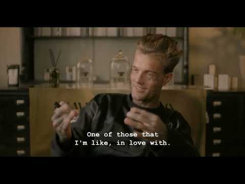 Fragrance review of Petit Sauvage Eau de Parfum with a backdrop of fresh lemons, highlighting its citrus and tropical notes