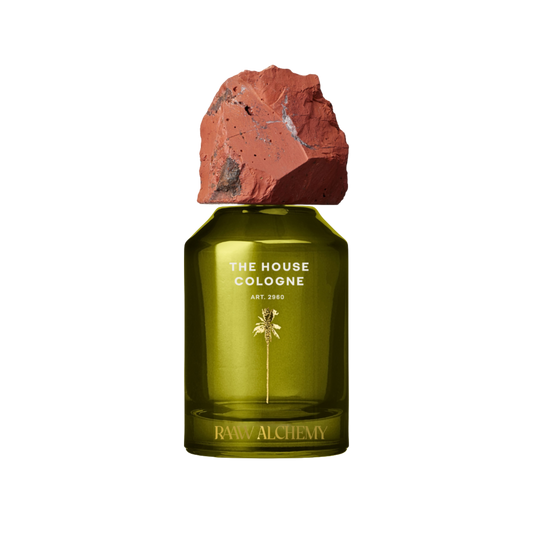 RAAW Alchemy house cologne - luxurious green glass flask with red jasper cap.
