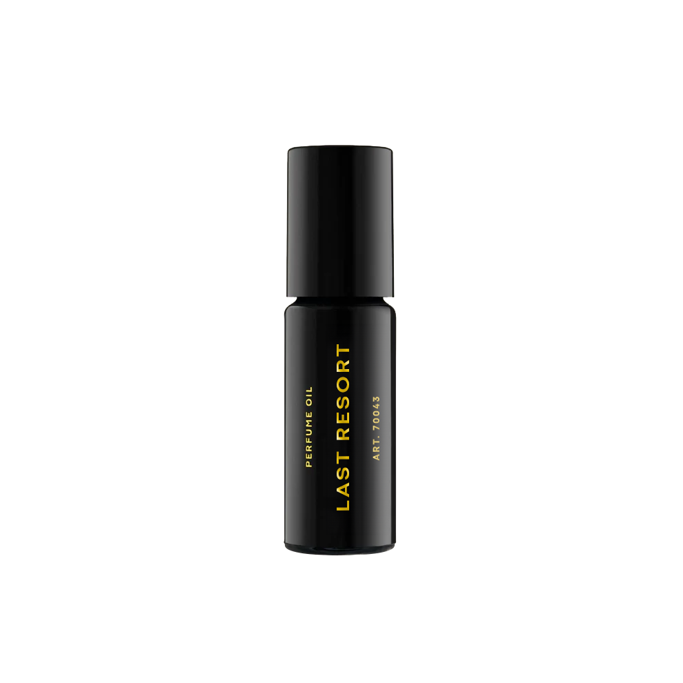 RAAW Alchemy Last Resort perfume oil rollerball, a clean and sophisticated scent in a compact black glass bottle.