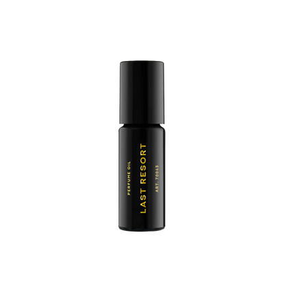 RAAW Alchemy Last Resort perfume oil rollerball, a clean and sophisticated scent in a compact black glass bottle.