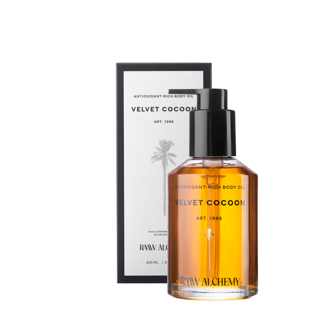 RAAW Alchemy Velvet Cocoon Body Oil bottle and its elegant display box.