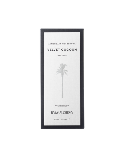 Minimalist white and black luxury packaging for RAAW Alchemy Velvet Cocoon Body Oil.