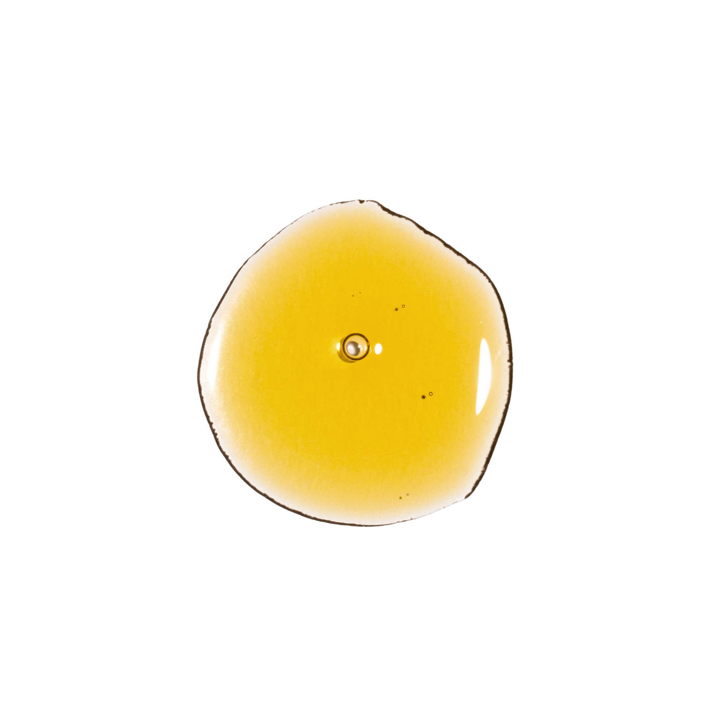 Golden texture drop of RAAW Alchemy Velvet Cocoon Body Oil showing the rich and nourishing consistency.