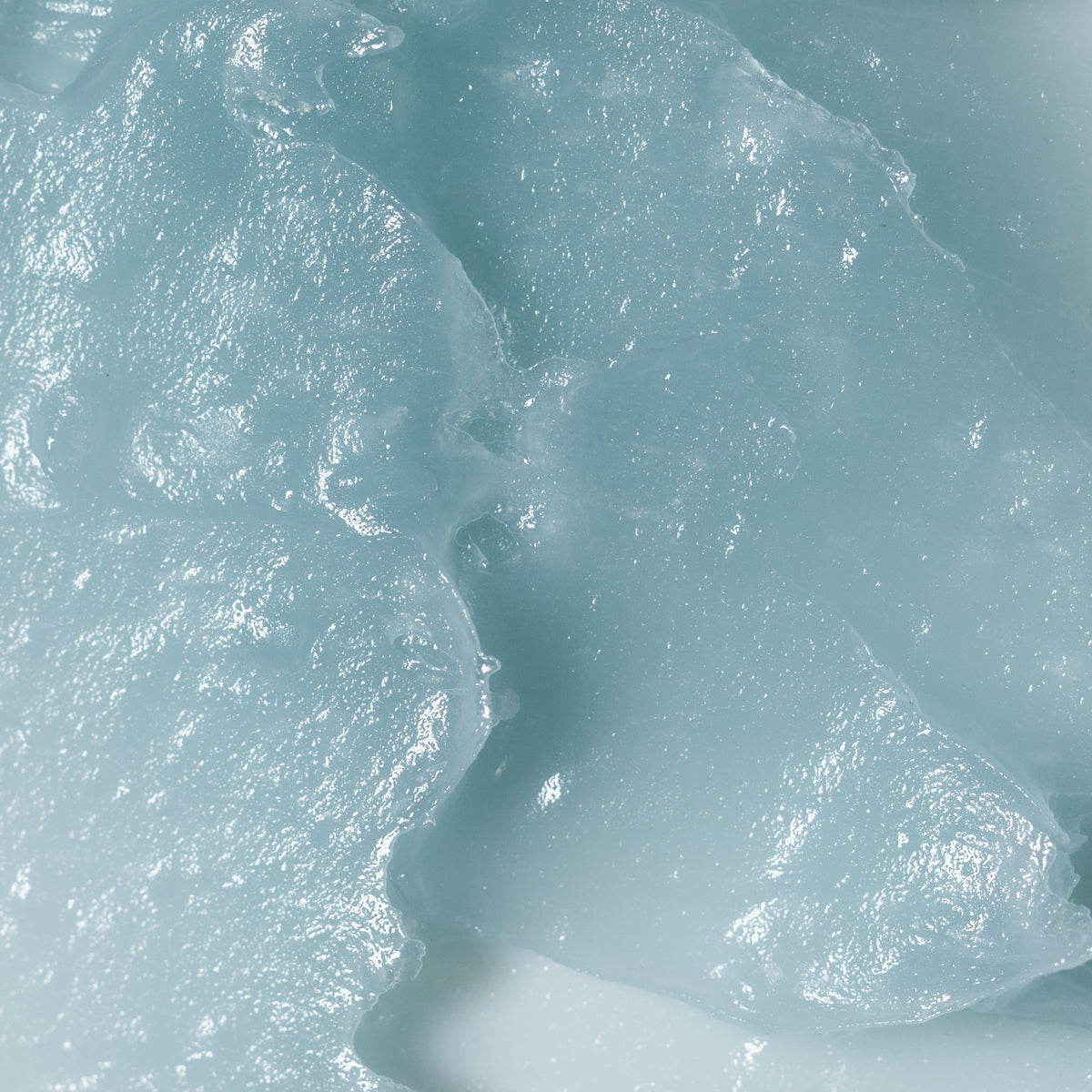 Close-up of the soothing blue botanical formula of RAAW Alchemy Calming Blue Balm.